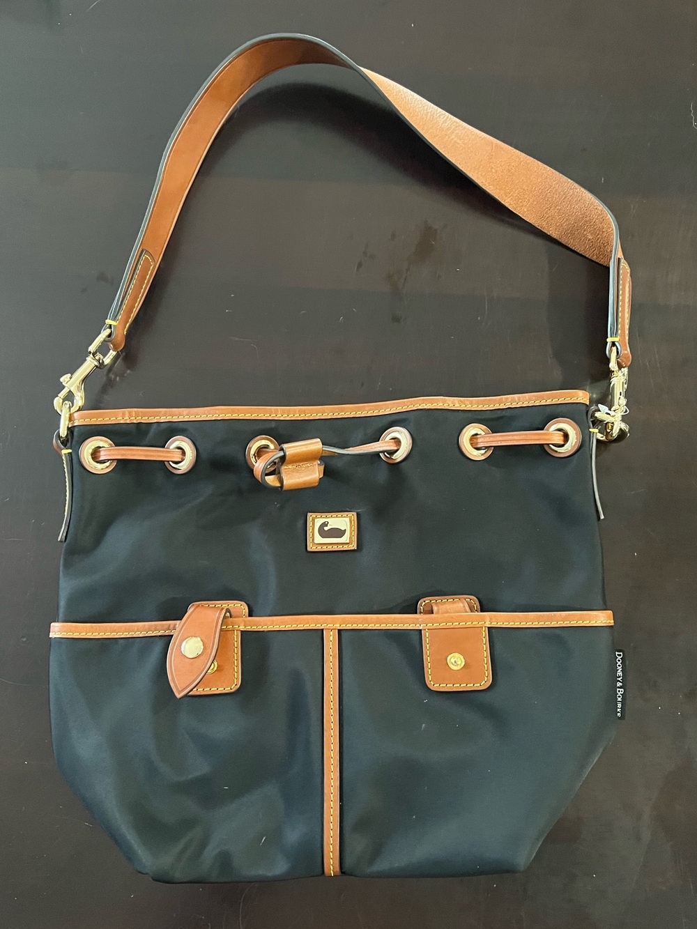 Dooney & Bourke Black nylon and Tan leather  Drawstring bucket Shoulder Bag
